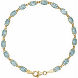 Oval Natural Sky Blue Topaz Line Bracelet In Gold & Platinum