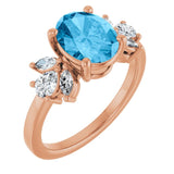 Oval Swiss Blue Topaz & Diamond Accented Ring in Gold and Platinum