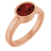Oval Mozambique Garnet Solitaire Ring in Gold and Platinum