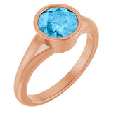 Round Swiss Blue Topaz Solitaire Ring in Gold and Platinum