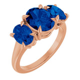Oval Lab-Grown Blue Sapphire Three Stone Ring in Gold and Platinum