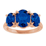 Oval Lab-Grown Blue Sapphire Three Stone Ring in Gold and Platinum