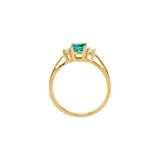 Round Emerald Three Stone Ring with Diamond Accents in Yellow Gold