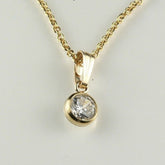 0.33Ct Bezel Set Solitaire Round Pendant Necklace in Yellow Gold