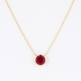 Bezel-Set Round Ruby Solitaire Pendant Necklace.