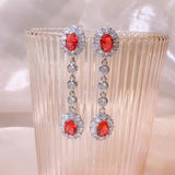 0.47Ct Ruby and Diamond Dangle Drop Earrings in White Gold