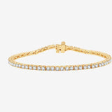 Bracelet de tennis en or jaune serti de diamants, style rub over.
