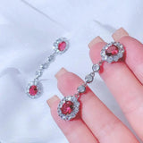 0.47Ct Ruby and Diamond Dangle Drop Earrings in White Gold