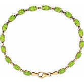 Oval Natural Peridot Line Bracelet In Gold & Platinum