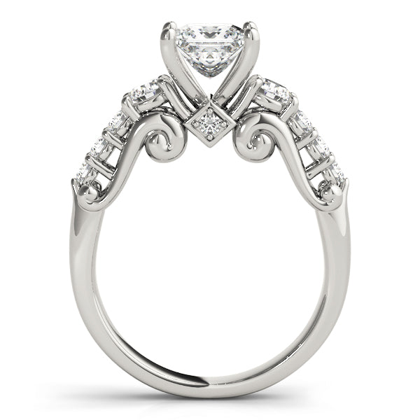 Silver ring with heart-shaped diamond on a white background