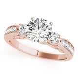 Rose gold ring with three diamonds on a white background