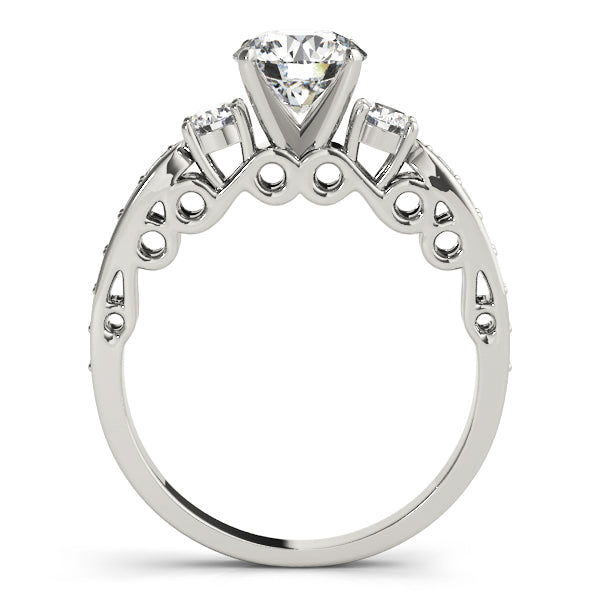 Diamond ring with three clear gemstones on a white background