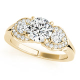 Gold ring with three diamonds on a white background