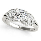 Diamond ring with three circular diamonds on a white background