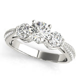 Three-stone diamond ring on a white background