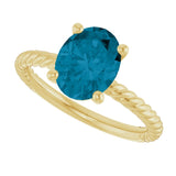 Oval London Blue Topaz Solitaire Ring in Gold