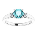 Round Blue Zircon Accented Ring with Diamond Accents in Gold