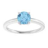 Round Sky Blue Topaz Solitaire Ring in Gold and Platinum