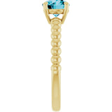 Round London Blue Topaz Solitaire Ring in Gold and Platinum