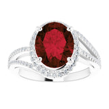 Oval Mozambique Garnet & Diamond Halo Ring in Gold and Platinum