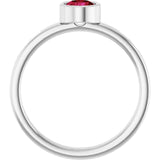 Round Ruby Solitaire Ring in Gold and Platinum