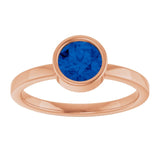 Round Blue Sapphire Solitaire Ring in Gold and Platinum
