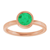Round Emerald Solitaire Ring in Gold and Platinum