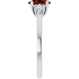 Oval Mozambique Garnet & Diamond Accented Ring in Gold and Platinum