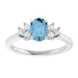 Oval Sky Blue Topaz & Diamond Accented Ring in Gold and Platinum