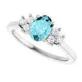 Oval Blue Zircon Accented Ring with Diamond Accents in Gold