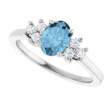 Oval Sky Blue Topaz & Diamond Accented Ring in Gold and Platinum