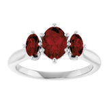Oval Mozambique Garnet Three Stone Ring in Gold and Platinum