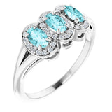 Oval Blue Zircon & Diamond Three Stone Ring in Gold and Platinum