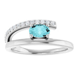 Oval Blue Zircon & Diamond Accented Ring in Gold and Platinum