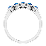 Round Blue Sapphire Accented Ring in Gold and Platinum