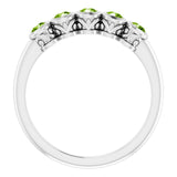 Round Peridot Accented Ring in Gold and Platinum