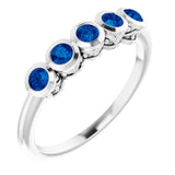 Round Blue Sapphire Accented Ring in Gold and Platinum