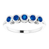 Round Blue Sapphire Accented Ring in Gold and Platinum