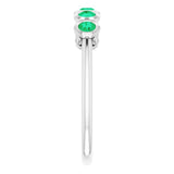 Round Lab-Grown Emerald Accented Ring in Gold and Platinum