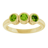 Round Peridot Three Stone Ring in Yellow Gold
