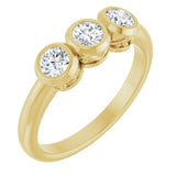 Round White Sapphire Three Stone Ring in Yellow Gold