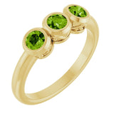 Round Peridot Three Stone Ring in Yellow Gold