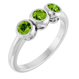 Round Peridot Three Stone Ring in Gold and Platinum