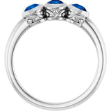 Round Blue Sapphire Three Stone Ring in White Gold