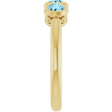 Round Aquamarine Three Stone Ring in Yellow Gold
