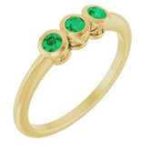 Round Emerald Three Stone Ring in Gold