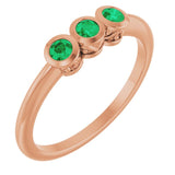 Round Emerald Three Stone Ring in Rose Gold