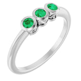 Round Emerald Three Stone Ring in Platinum