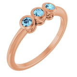 Round Aquamarine Three Stone Ring in Rose Gold