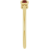 Round Mozambique Garnet Three Stone Ring in Yellow Gold